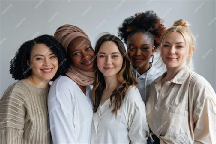 A diverse group of women using makeup premium image by