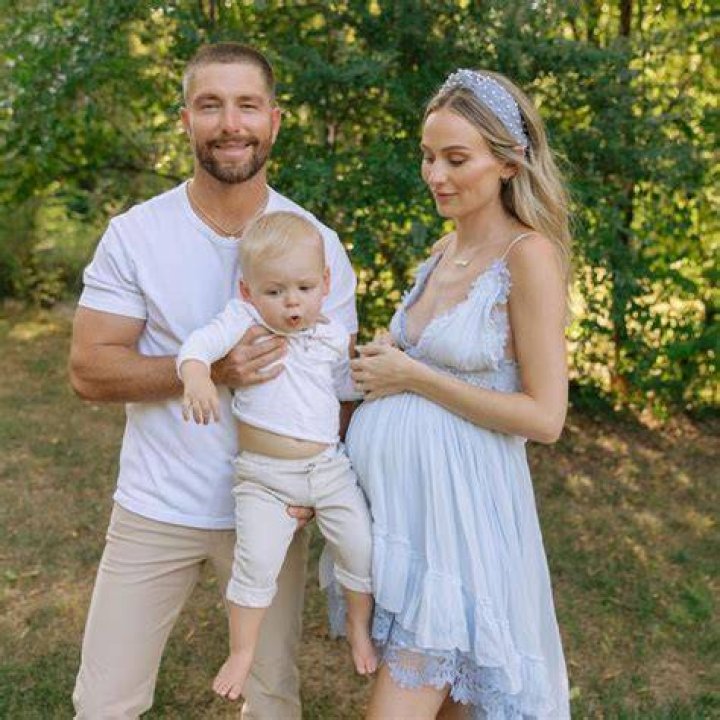 Chris Lane Kisses Pregnant Wife Lauren Bushnell in Christmas Photo