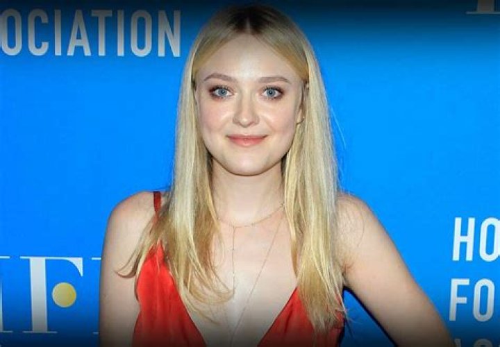 Dakota Fanning keeps a firm grip on her new man as she pulls him out of