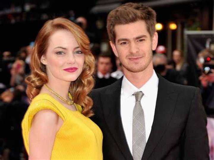 Emma Stone and Andrew Garfield Sept. 15 use the paparazzi to promote
