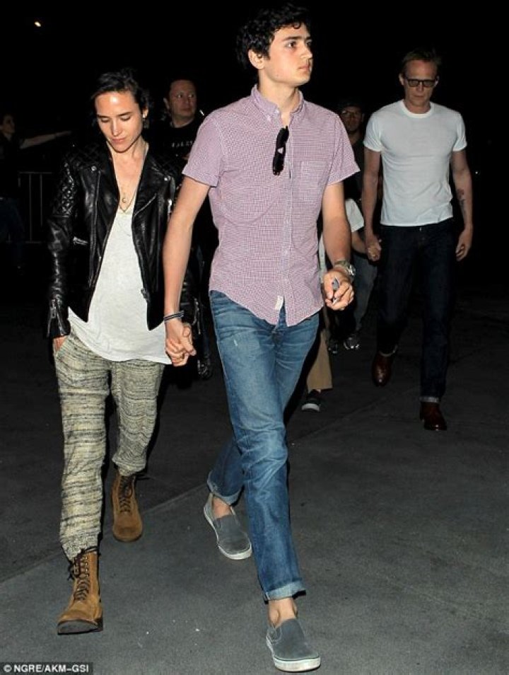 Jennifer Connelly is dwarfed by her teenage son as they walk through