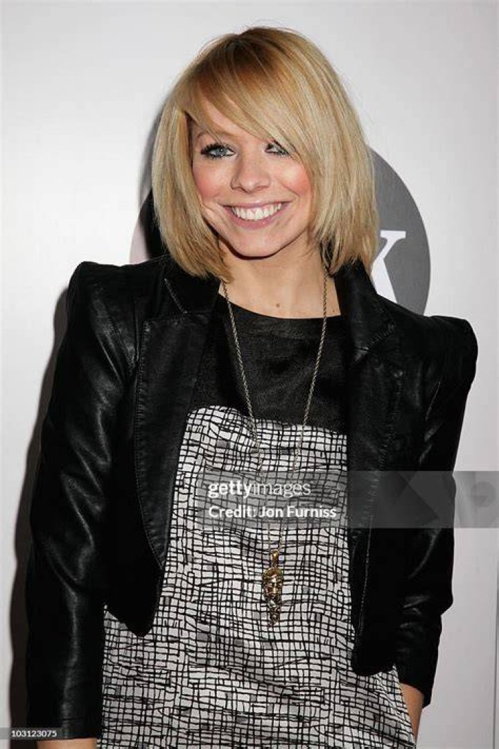 Liz McClarnon attends fashion show with male companion at the