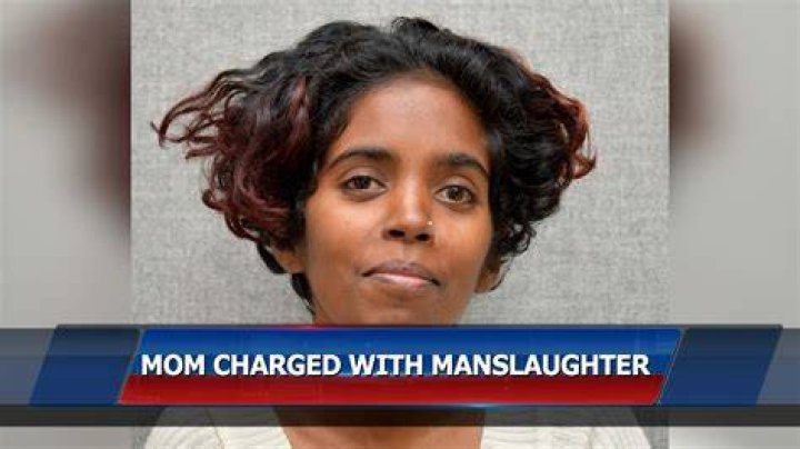 Mom of brothers charged in cop's killing arrested while visiting son