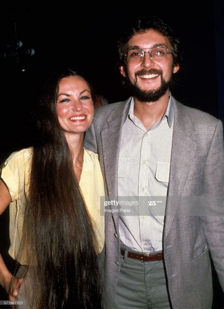 What does Crystal Gayle's husband do for a living?