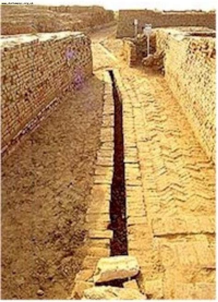 What was the primary material of the drains at Mohenjo Daro?